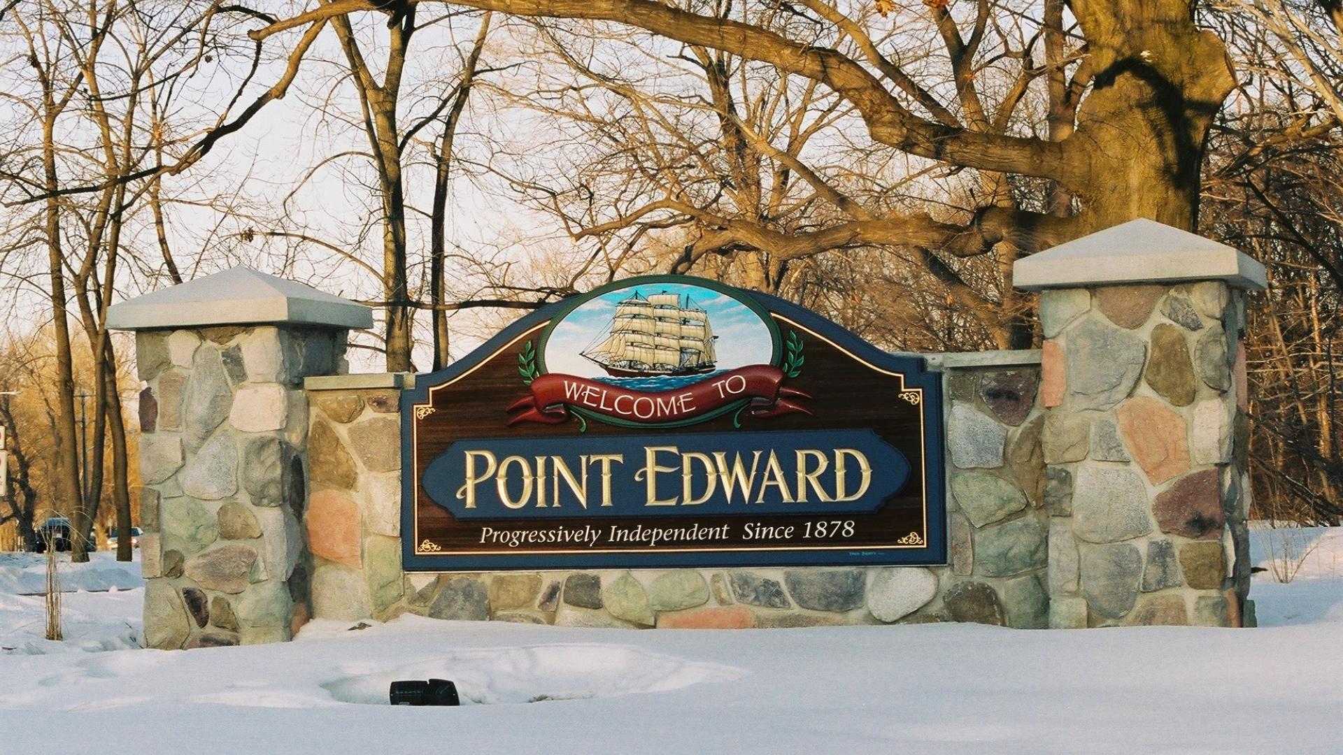 Point Edward welcome sign. The sign has a a large sailboat over the Point Edward wording.