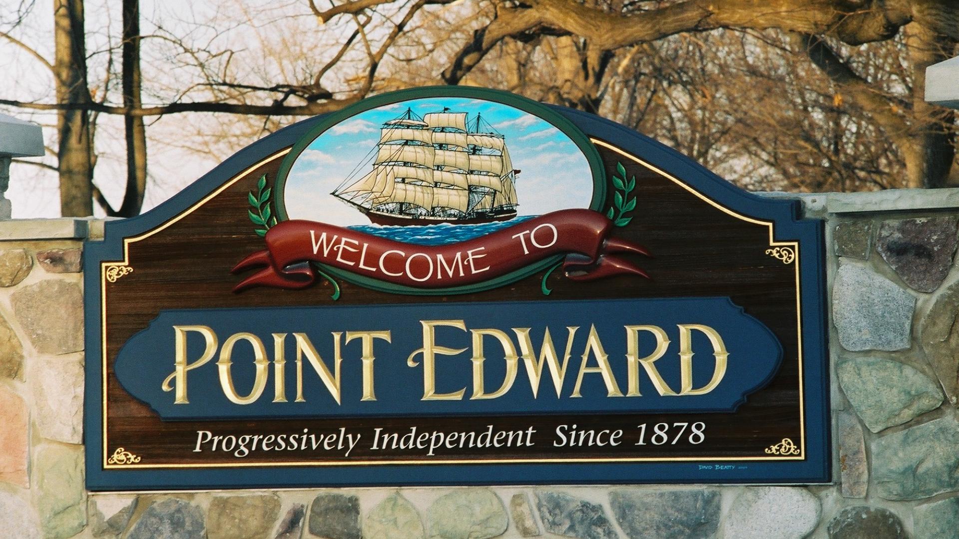 Point Edward welcome sign. The sign has a a large sailboat over the Point Edward wording.