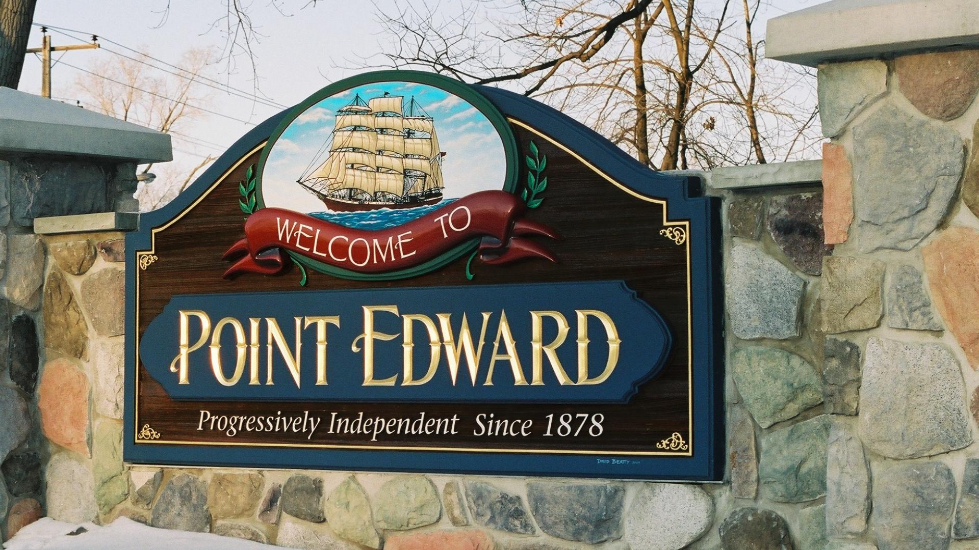 Point Edward welcome sign. The sign has a a large sailboat over the Point Edward wording.