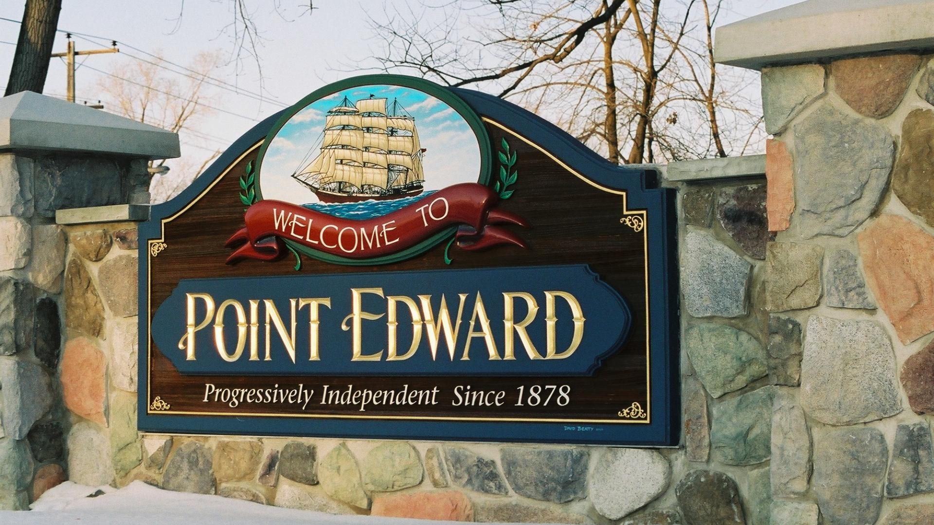 Point Edward welcome sign. The sign has a a large sailboat over the Point Edward wording.