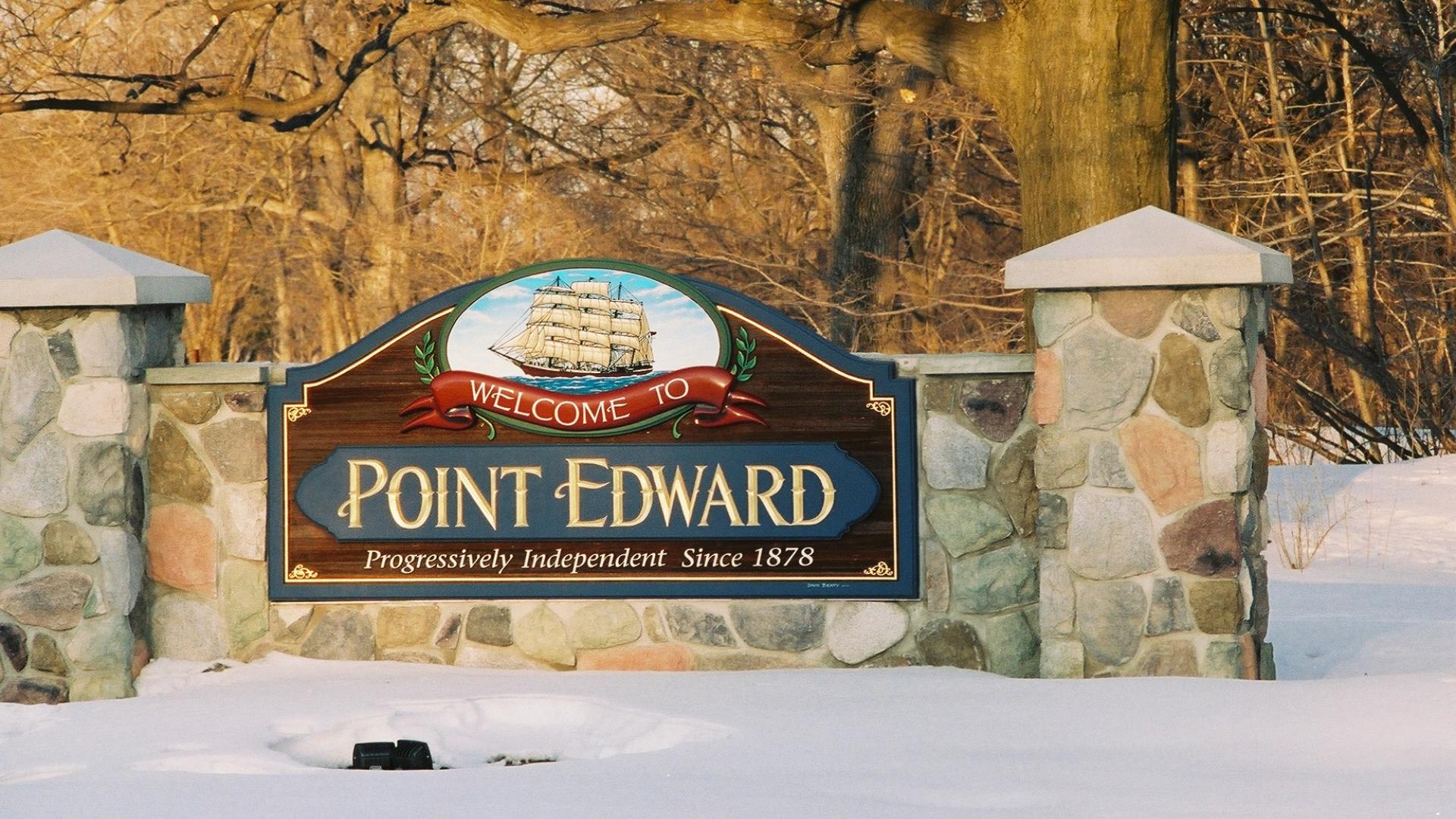 Point Edward welcome sign. The sign has a a large sailboat over the Point Edward wording.