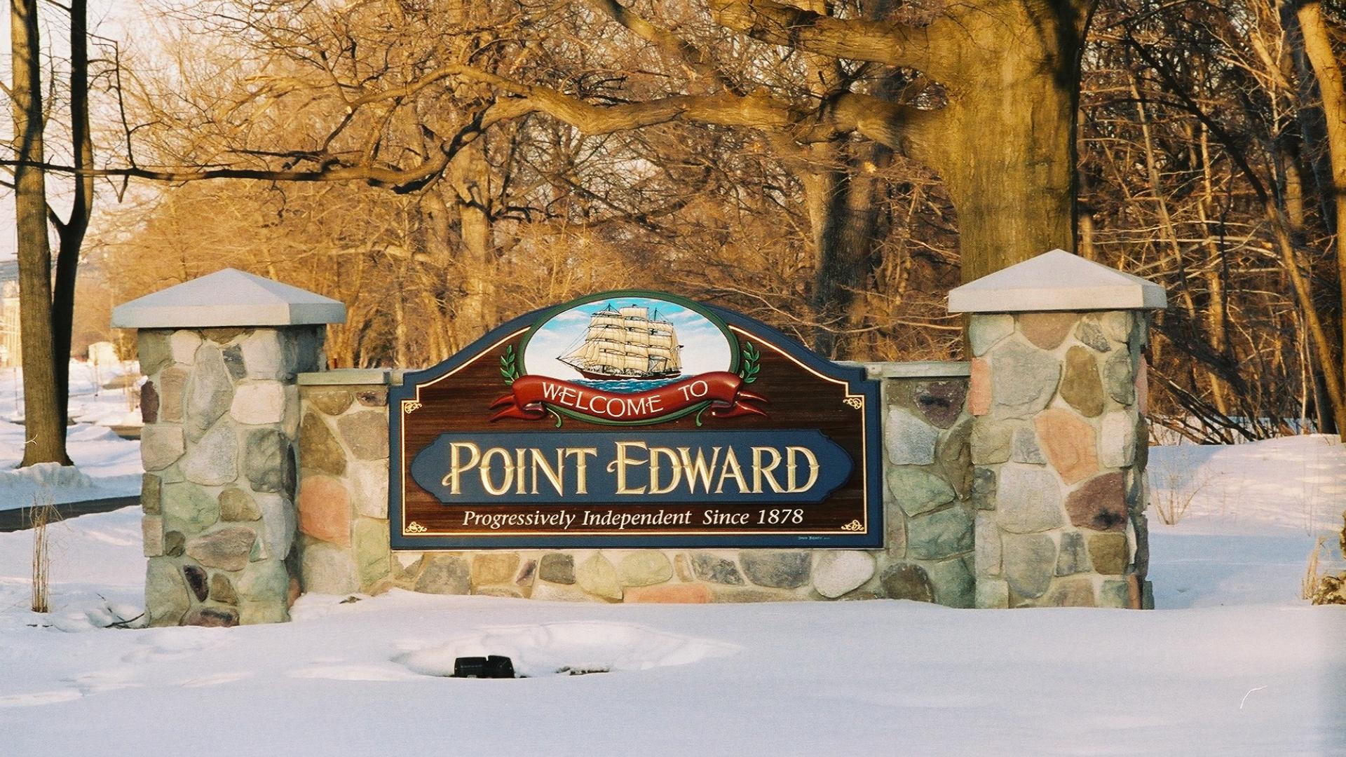 Point Edward welcome sign. The sign has a a large sailboat over the Point Edward wording.