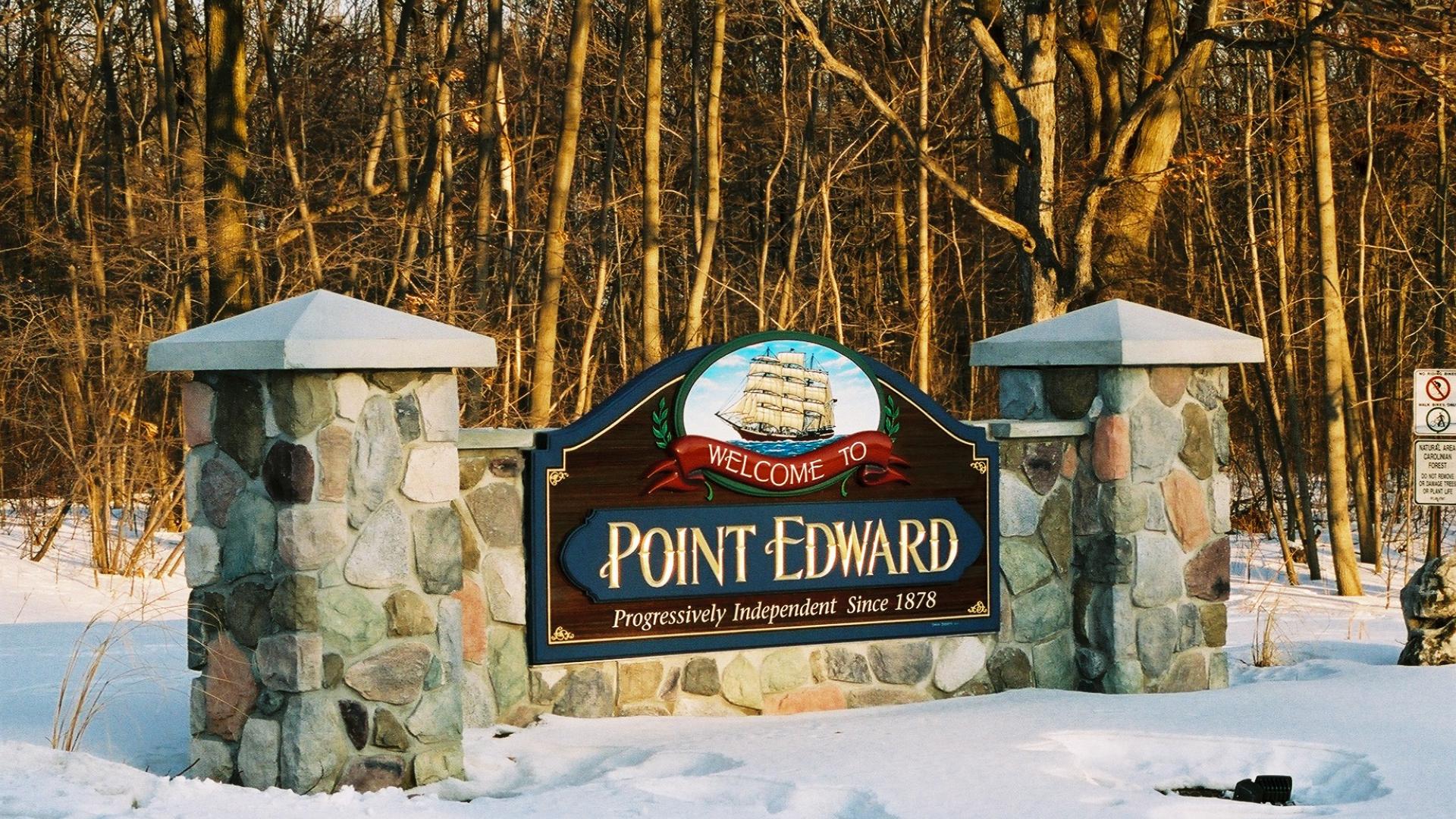 Point Edward welcome sign. The sign has a a large sailboat over the Point Edward wording.