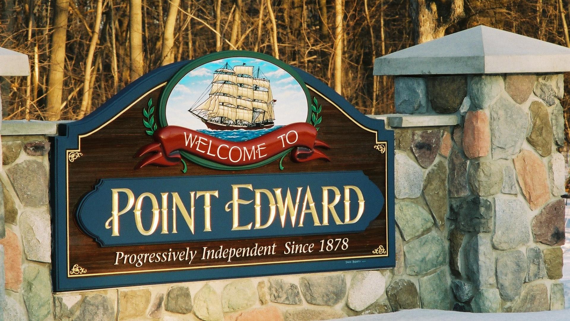 Point Edward welcome sign. The sign has a a large sailboat over the Point Edward wording.