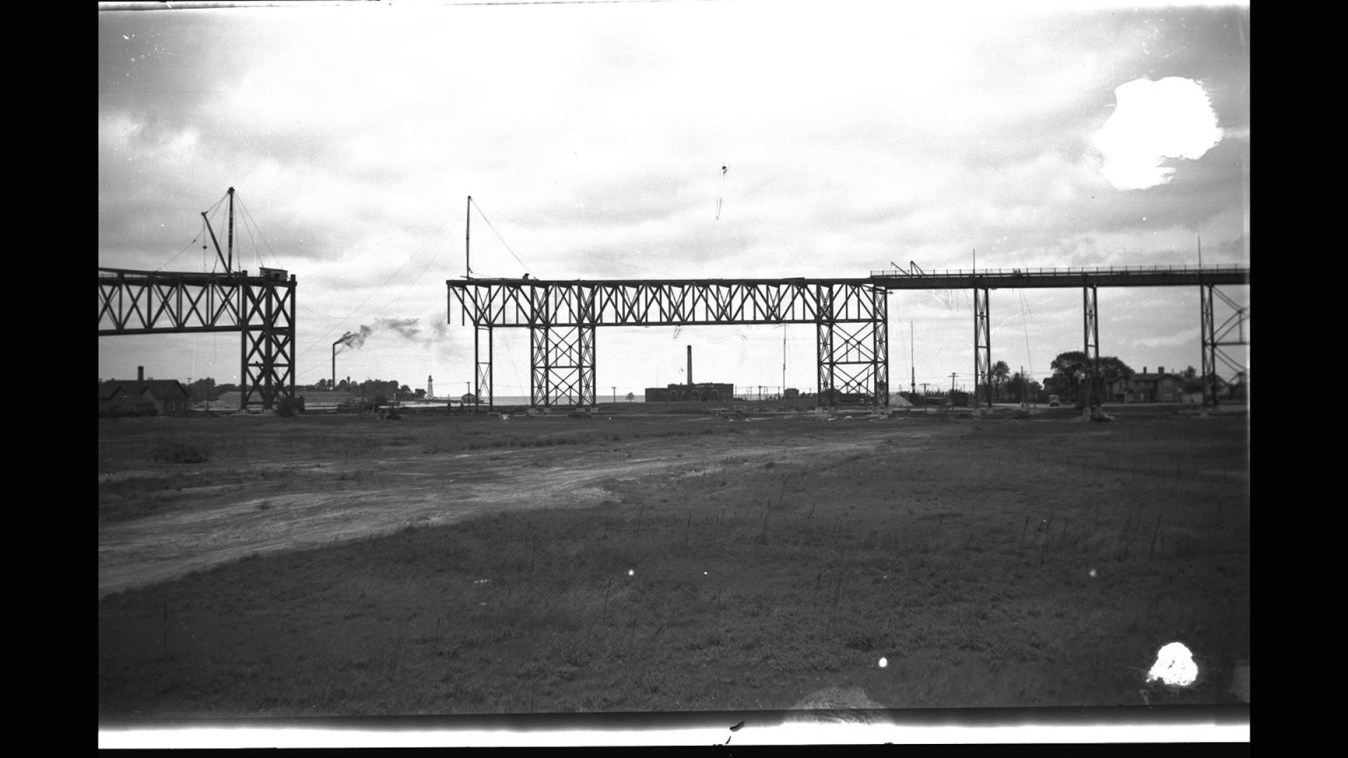 Bridge under construction. There are clouds in the background.