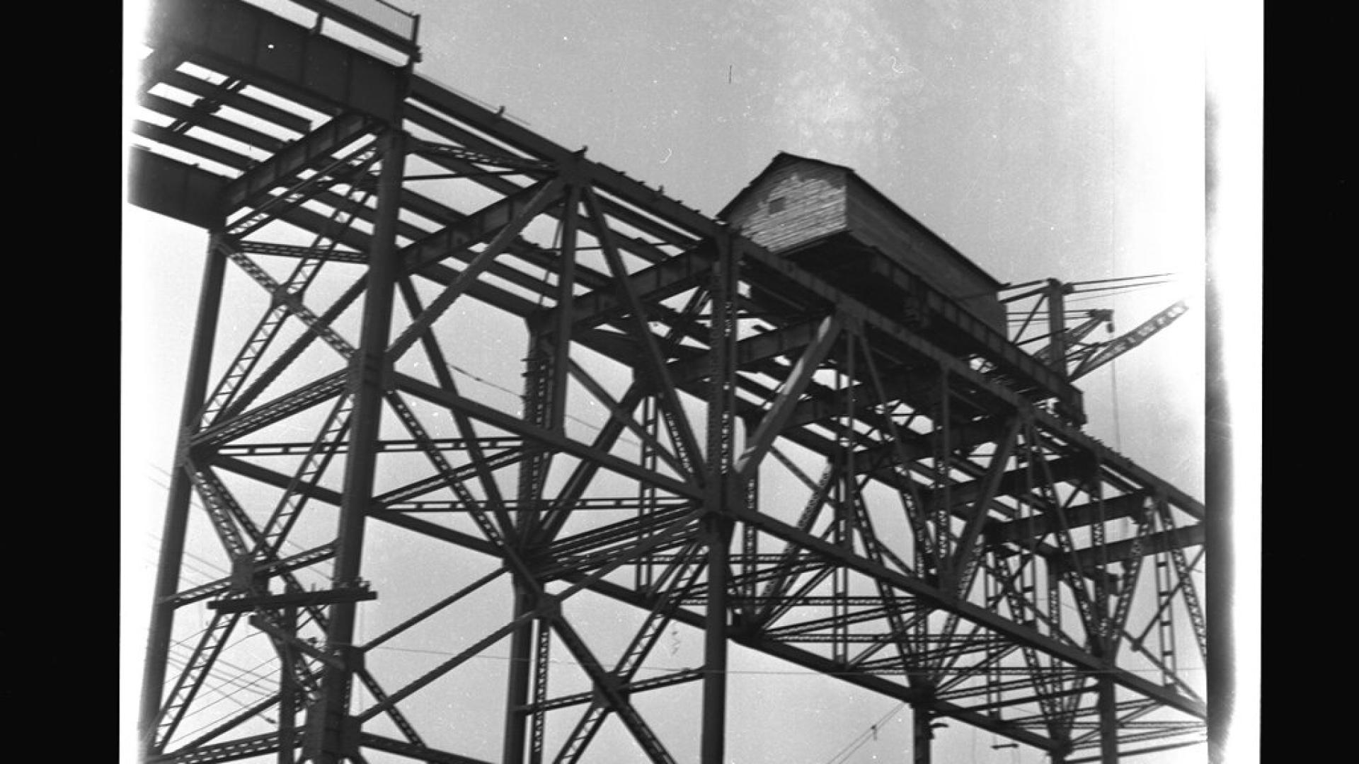 Construction structure on bridge that is being built. The structure is in the form of a small house.