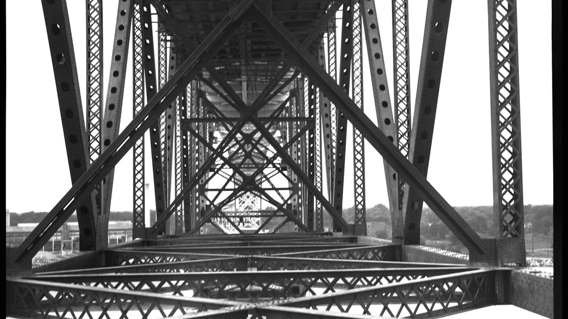 Inside perspective of steel bridge. The bridge is made out of iron beams.