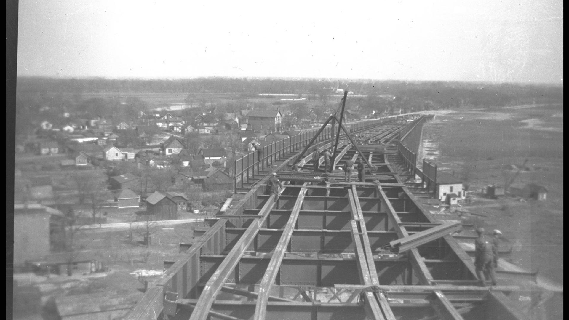 On bridge perspective. The bridge stands tall over the city below. 