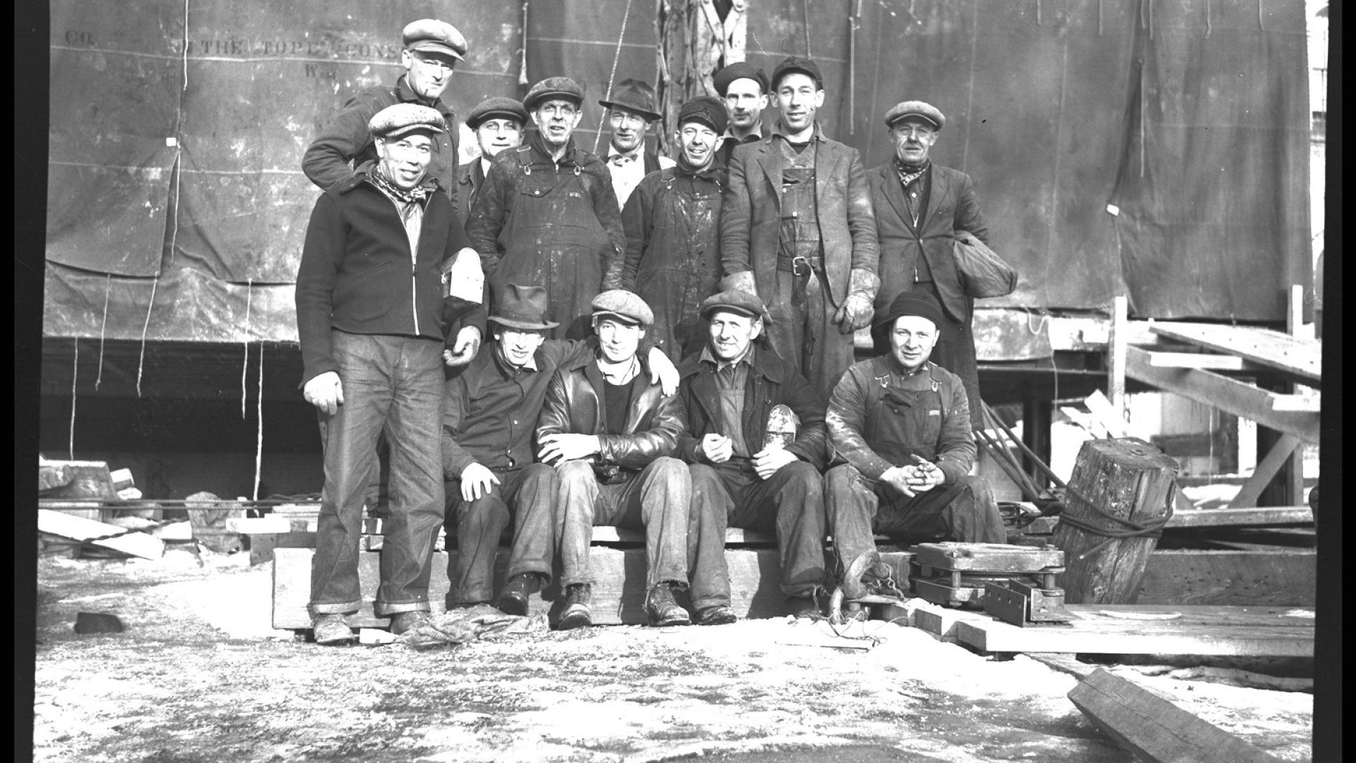 Group of men posing for photograph.