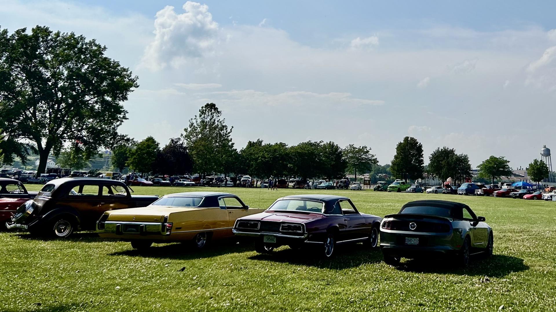 Classic cars parked on the grass in Point Edward's Waterfront Park